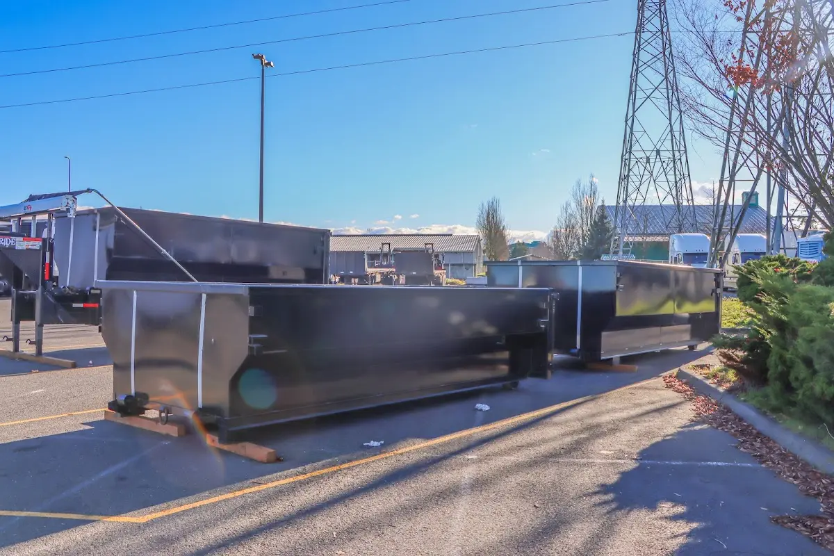 Roll-off dumpster ready for waste disposal at job site for 12 Yard Dumpster Rental in Sioux Falls
